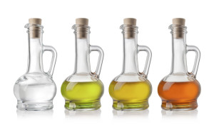 Glass Bottles Of Oil And Vinegar On White Background